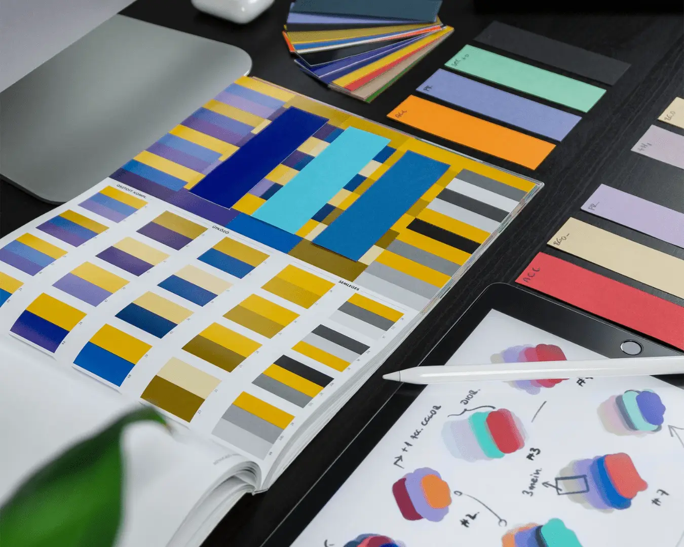 Brand identity materials displayed on a desk, illustrating a refreshed business brand